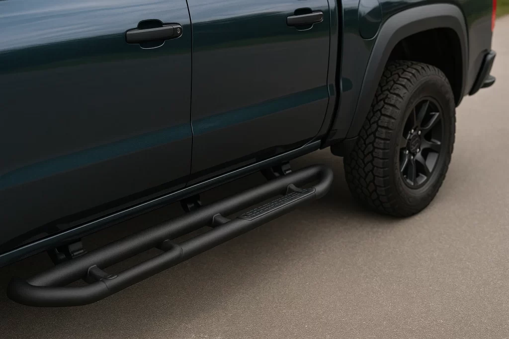 Matte black side steps on blue pickup highlighting pickup truck accessories near me